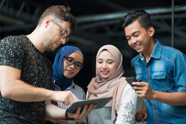 Group of people looking at tablet