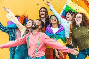 Group of people cheering and smiling.